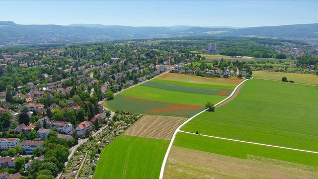 Basel: Aerial view of city in Switzerland at border with France and Germany, city outskirts with modern residential buildings, clear blue sky - landscape panorama of Europe from above