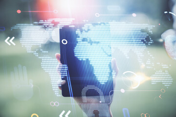 Double exposure of map sketch hologram and woman holding and using a mobile device.