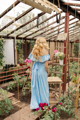 Obraz na płótnie Canvas girl in a greenhouse
