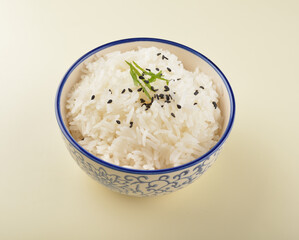 steamed fragrant white jasmine rice in Japanese ceramic bowl on white table restaurant asian cafe halal chinese banquet menu
