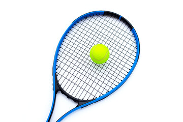 Tennis racket with ball on white.