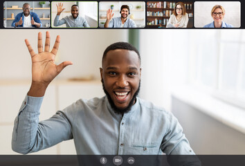 Smiling diverse businesspeople making online videochat, screen view