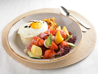 popular chef cook fried sweet and sour chicken with vegetables serve with steam white rice asian halal menu