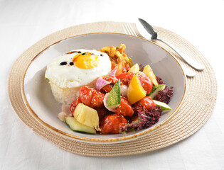 popular chef cook fried sweet and sour chicken with vegetables serve with steam white rice asian halal menu