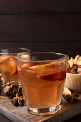 Delicious compote and ingredients on wooden table, closeup