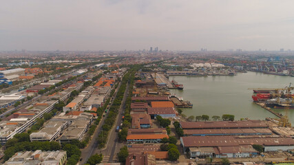 aerial view cargo and passenger seaport with ships and crane Tanjung Perak, surabaya, indonesia. docks for the repair and parking of ships, cargo port and container terminal. ship in industrial port