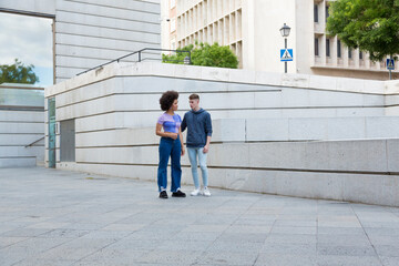 friends talking standing on the street