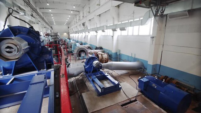 Equipment at electric pumping station. Pumps deliver water to city. Water pressure valve station plant industrial treatment purification equipment. Water treatment and water purification