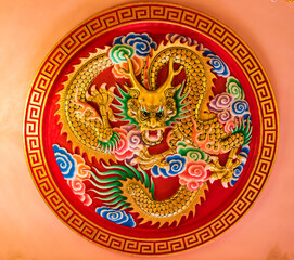 Dragon art on the red wall, believed to be a mythical creature of Chinese people.