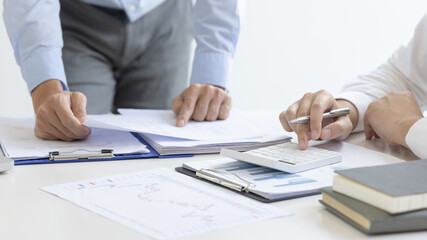 Brainstorm team, Marketers and financial accountants are discussing and analyzing charts to plan strategies to meet customer needs, Team meetings or business consulting.