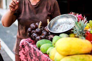 person holding a bowl of vegetables