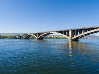 Krasnoyarsk city. Communal bridge over the Yenisei River. Summer sunny day