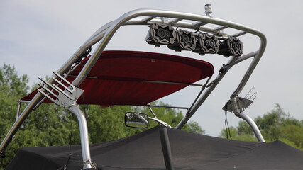 Close up tower Targa top, a pole for towing water-skiing on a motor boat with speakers and a holder...