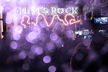 Fototapeta na wymiar blurred background rock concert, night club, music, crowd of people a lot