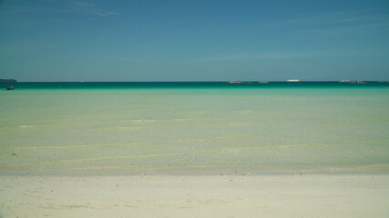 Tropical beach and turquoise water on the island of Boracay, Philippines. Summer and travel...