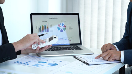 Business concept a male startup entrepreneur presenting business data in dashboard to an investor for the business expansion.
