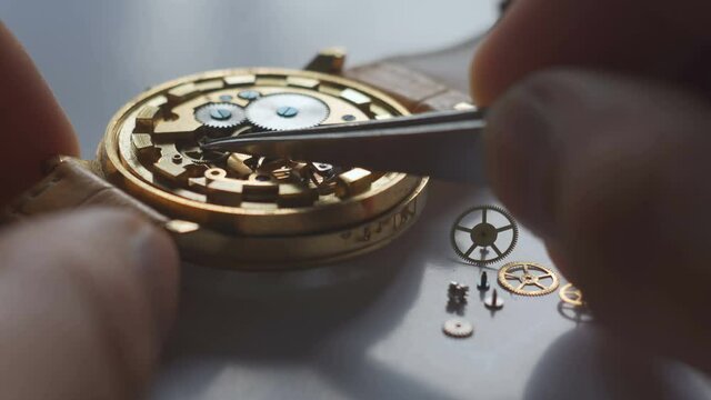 Watchmaker repair mechanical watches. Gears repair. Watch repair process