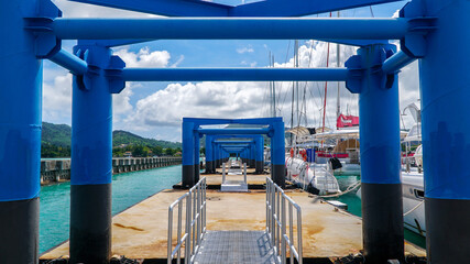 Boast on Phuket Island in Thailand. Chalong Pier
