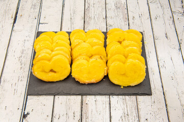 Black rectangle slate plate with mini bud palm trees on white table