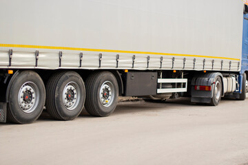 Fototapeta na wymiar Truck wheels. Transportation of goods in freight transport.