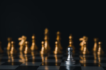 Silver king winner surrounded with silver chess pieces on chess board game competition.concept strategy, leadership and success business.
