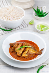 Pomfret Fish, Indian cuisine, white background, rustic setup 