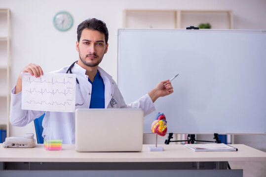 Young male doctor cardiologist in the classroom
