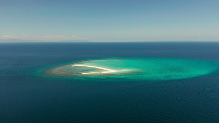 Fototapeta na wymiar Sandy white island with beach and sandy bar in the turquoise atoll water, aerial drone. Sandbar Atoll. Tropical island and coral reef. Summer and travel vacation concept, Camiguin, Philippines.