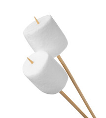 Sticks with delicious puffy marshmallows on white background