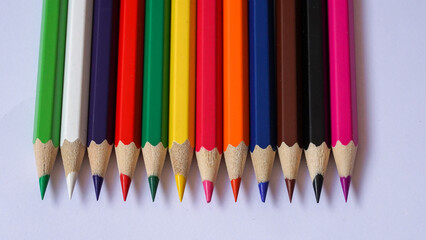 Close up of colored pencils on a white background