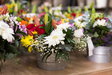 a bouquet of flowers in a vase on the table