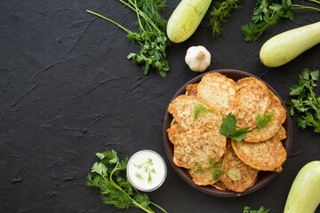 A healthy breakfast of zucchini pancakes. Creative atmospheric decoration