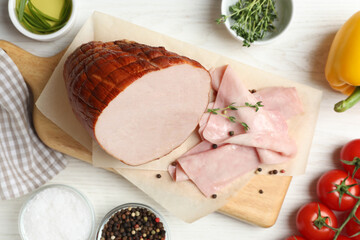 Delicious ham and ingredients on white wooden table, flat lay