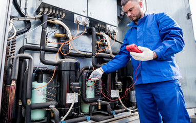 Fototapeta premium Resistance test of temperature sensors in the cooling supply section of the ventilation unit