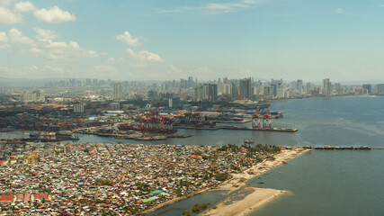 Fototapeta premium Cityscape of the capital of the Philippines Manila with the port and business centers, skyscrapers. Travel vacation concept
