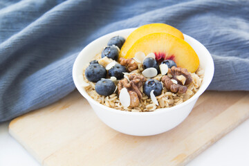 Oatmeal porridge with blueberries. Superfood for healthy nutritious breakfast
