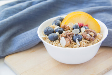 Oatmeal porridge with blueberries. Superfood for healthy nutritious breakfast