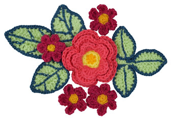 A decorative arrangement of handmade flowers and leaves isolated on white background.