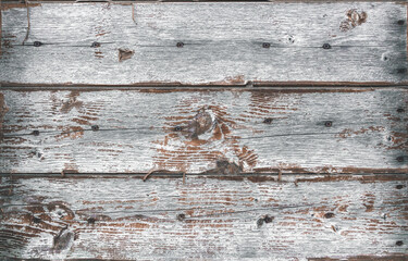 Wooden planks with rusty screws