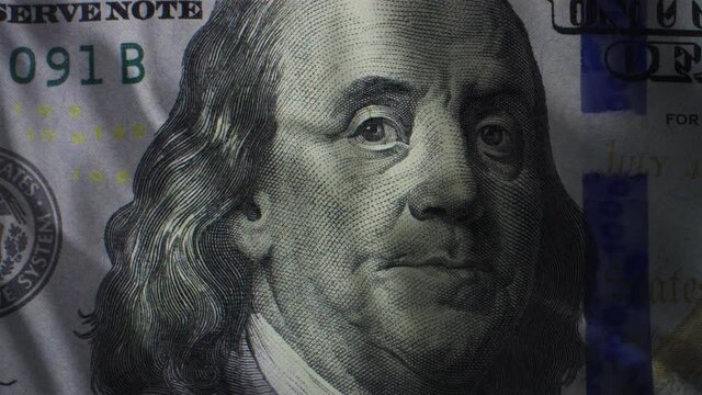 Benjamin Franklin On Hundred Dollar Bill As Waving Flag. The American Dollar Is The Basis Of Capitalism, Main Symbol Of The World Global Financial System