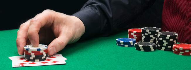 a game moment on the green table, increasing the bet with a winning combination of cards