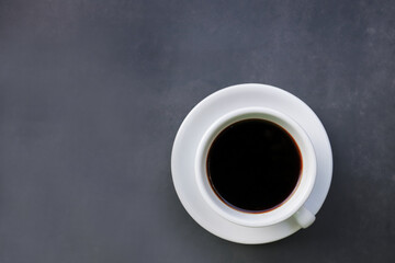 Obraz na płótnie Canvas Black Crema Esspresso coffee on cup and coffee beans top view on dark background