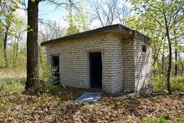 An abandoned public toilet on the territory of the former pioneer camp