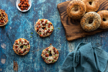 Top down view of homemade everything pizza bagels ready for eating.