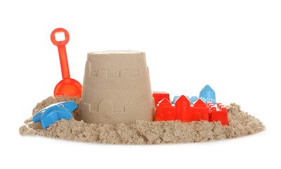 Plastic beach toys and figure on pile of sand against white background. Outdoor play
