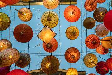 Colorful lanterns hang on the wall