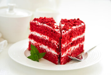 a piece of delicious red velvet cake on a plate.