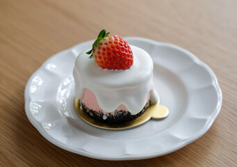 strawberry cheese cake on white palte.