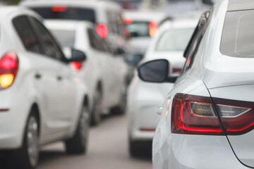 Close up of car stop light in traffic. Cars waiting at traffic in busy road. Traffic in crowd city concept.