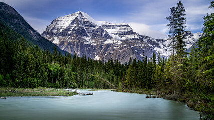 Long Exposure makes the Robson River look smooth with in the background the clear peak of Mount Robson, the highest peak in the Canadian Rockies, British Columbia, Canada